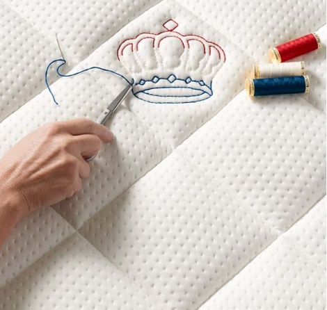 Auping 100 jaar vakamnschap uit nederland,kroon,rood,wit,blauw,matras,spiraal,bed